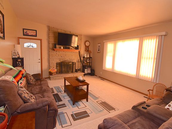 Large living room with lots of space to relax, not to mention lots of natural light