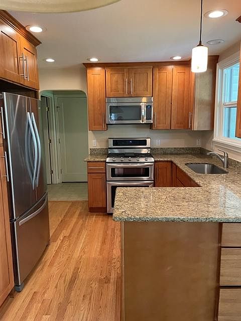 Granite counter tops and stainless steel appliances.