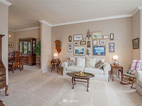 A commanding view of the living room and dining room from the entry.
