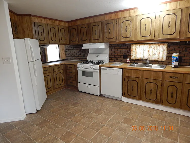 Kitchen -showing appliances and kitchen sink.