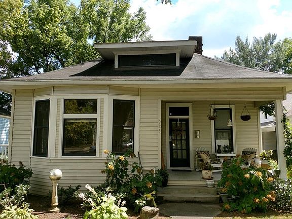 Entrance to apartment for rent is from the open side porch (left of photo).