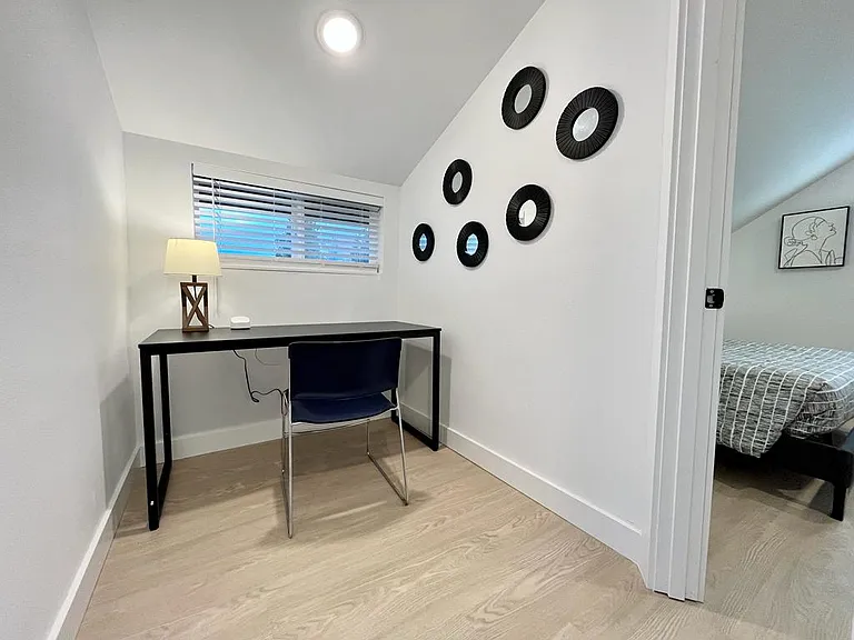 Productivity meets comfort in this well-designed workspace in the upstairs loft.