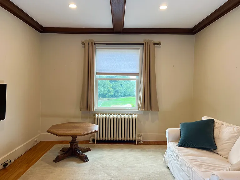 Living room looking toward front of the house, overlooking Spy Pond.