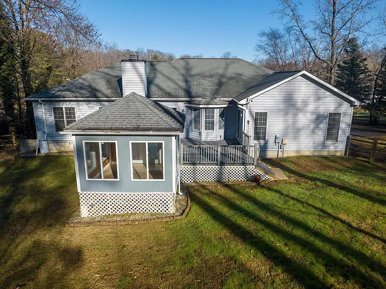 Rear of house showing detached sunroom