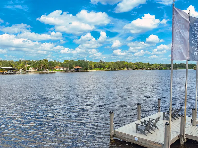 This inviting spot offers tranquility, where residents can unwind while casting a line or simply bask in the serene waterscape on the river.