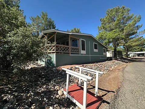Back of house, bridge to pool, gym and mailbox. 5 minute walk. No backyard neighbors!