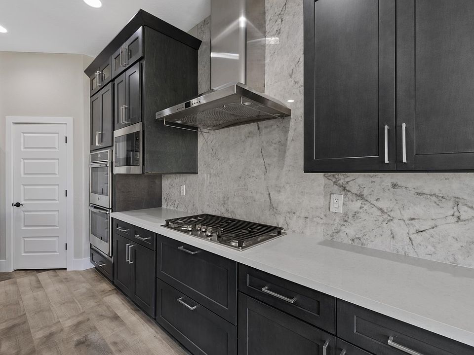 GE Profiles Cooktop, Hood, Double Oven, and Microwave