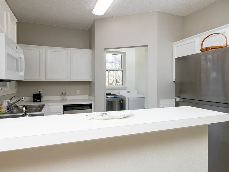 Fully stocked kitchen with ample counter space, stainless steel appliances, toaster, and kettle_everything you need to cook, snack, or sip in comfort.