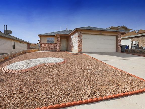 House has a 2-car garage with automatic door opener.