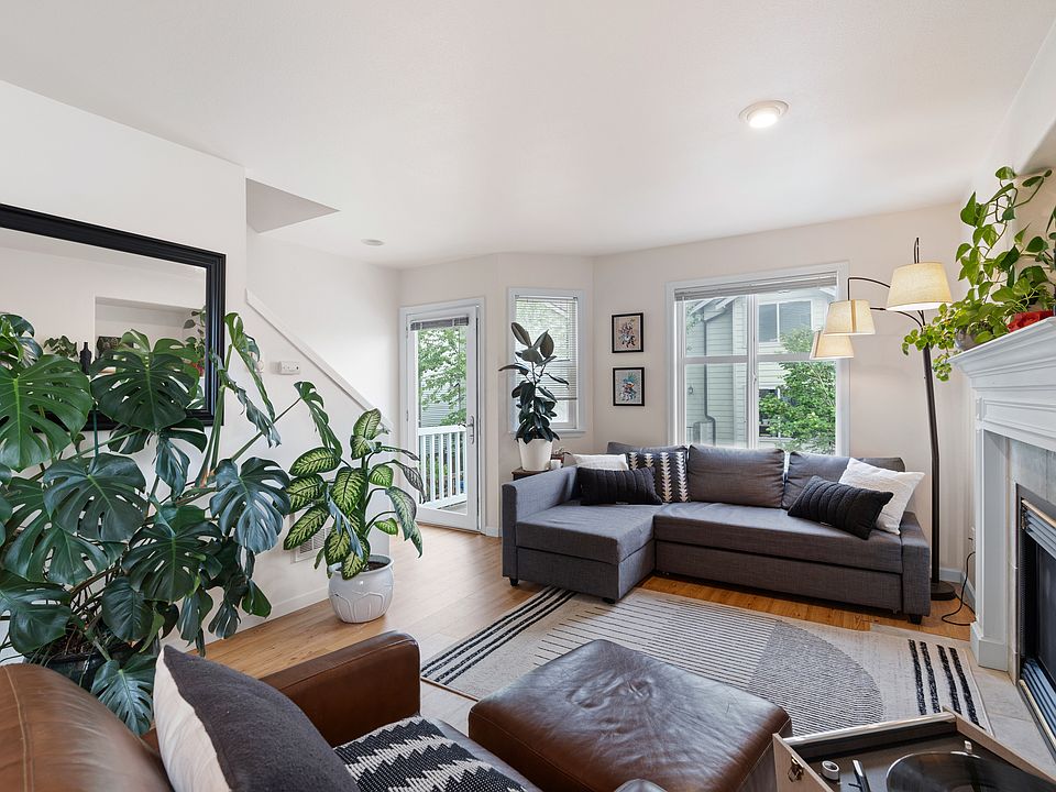 Open floor plan filled with natural light connects dining, living, and lounge areas_plus easy patio access for morning coffee or summer evenings.