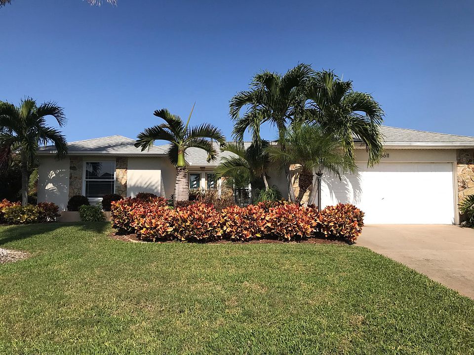 Rarely available gorgeous lakefront 2-car garage home minutes to the beach