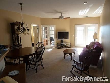 Living Room
						:
						French doors on right lead to porch, interior french doors enclose office
