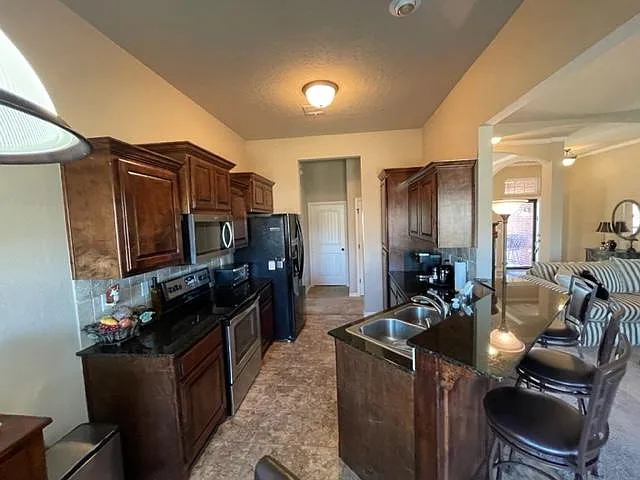 Beautiful kitchen is entertainers delight with generous counter space and tons of cabinets/storage plus a pantry. There is also a breakfast bar with 3 bar stools.