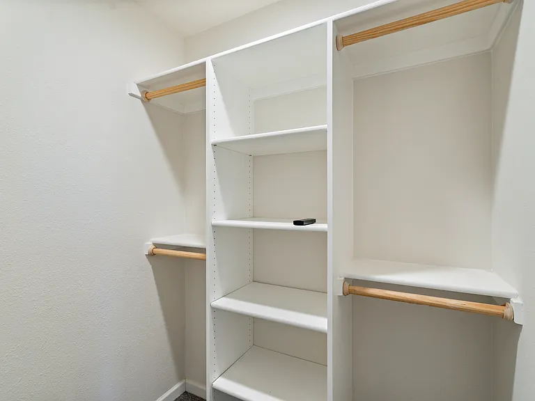 Primary bedroom - "his" closet