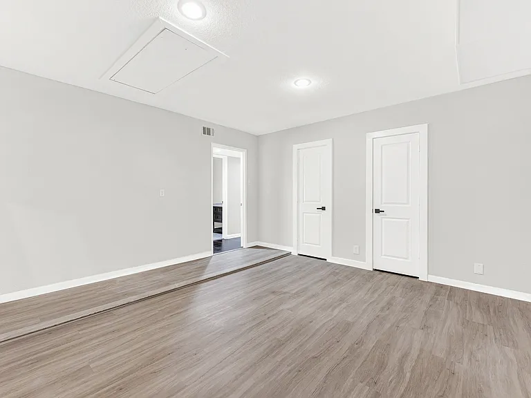 Spacious game room has a huge walk-in closet with access to the outside storage.