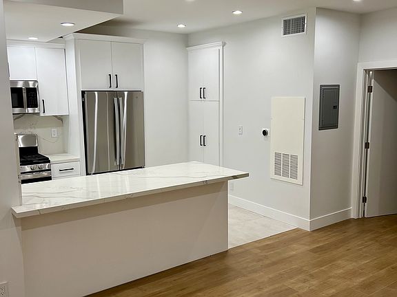 Completely Remodeled Top of the Line Kitchen and Custom Pantry - Stone Counters Custom Cabinets and Stainless Steel Appliances