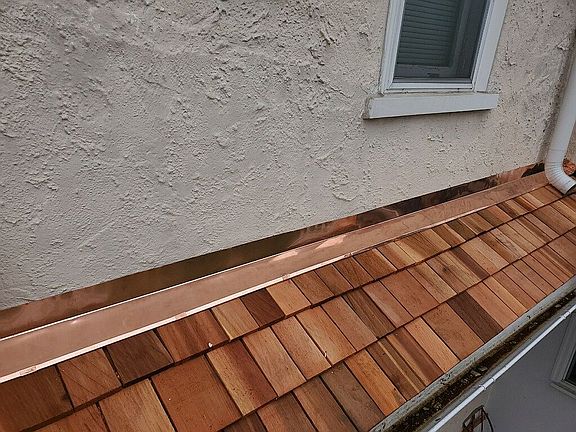 Copper flashing cedar roof