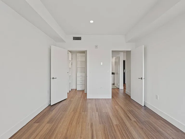 Bedroom with Walk-In Closet with Built-In Organizers