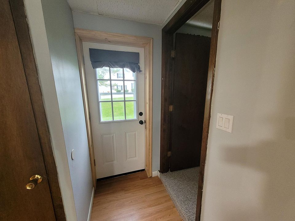 New Back door, the Bathroom is to the left, and Bedroom is to the right.