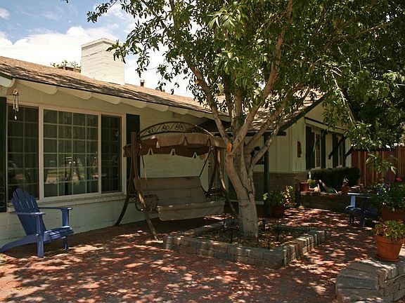 Enjoy the neighborhood from this beautiful front porch