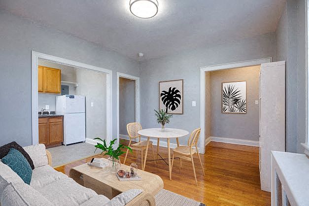 One-bedroom living and dining (virtually staged)