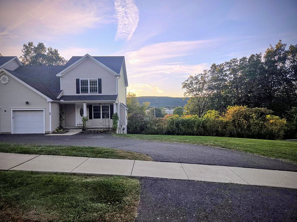 Beautiful home with front porch, 2 parking spots in front and 1 attached garage.