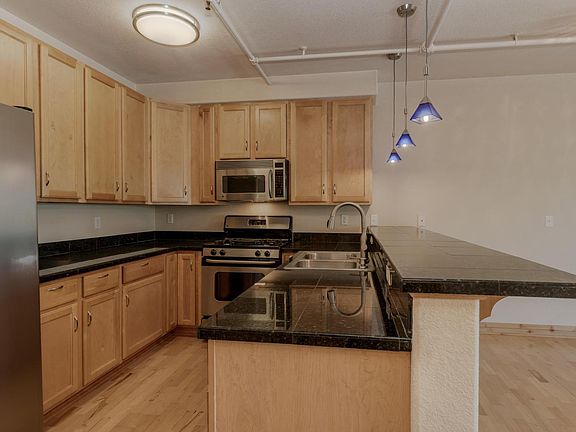 Kitchen includes refrigerator, oven, microwave, dishwasher, disposal and lots of cabinet space.