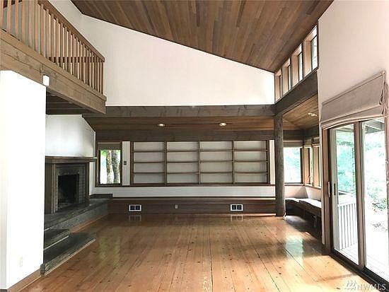 Main room with large wood burning fireplace.