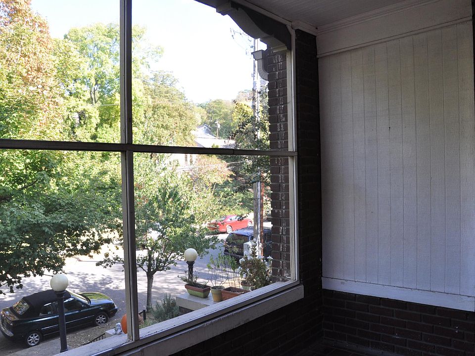 The screened in front porch overlooks tree-lined 42nd Street. Dining al fresco is a joy in the warmer months.