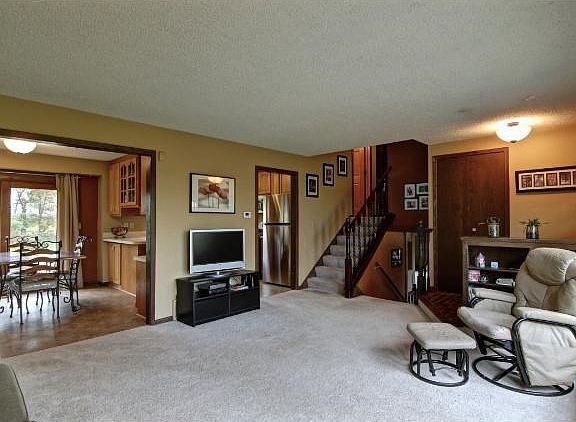 Living room flows into the open Kitchen and Dining room. There is a professionally landscaped large patio area just outside the sliding glass doors off the dining room, making this area great for entertaining!