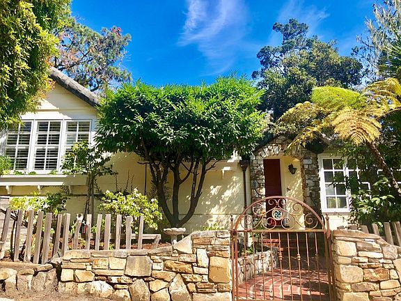 Carmel stone, grape stick fence and a charming rolled roof