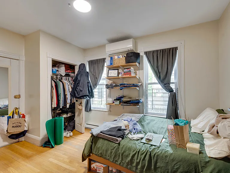 Rear right bedroom, access to balcony and back yard and laundry in basement.