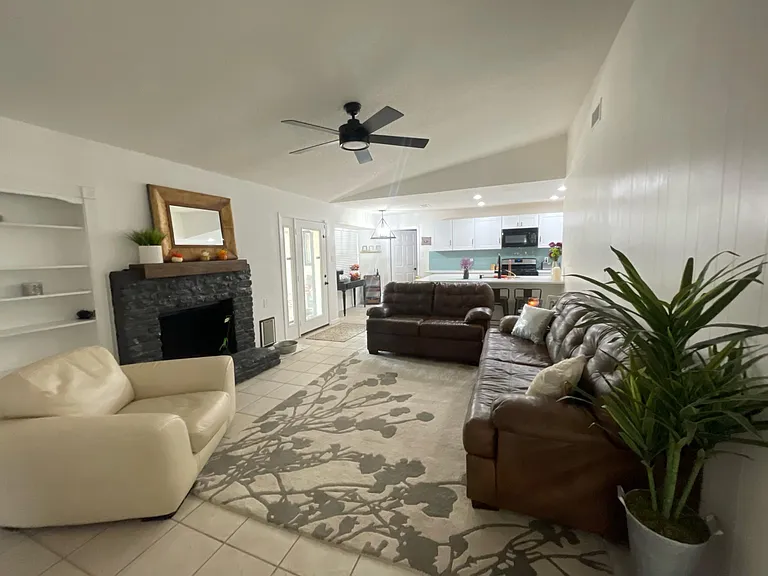 Family room open to the kitchen and connected to french doors going outside.