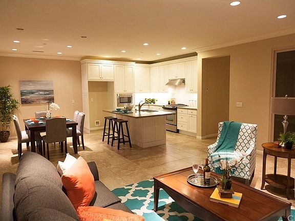 Open concept living area downstairs, recessed lighting throughout.