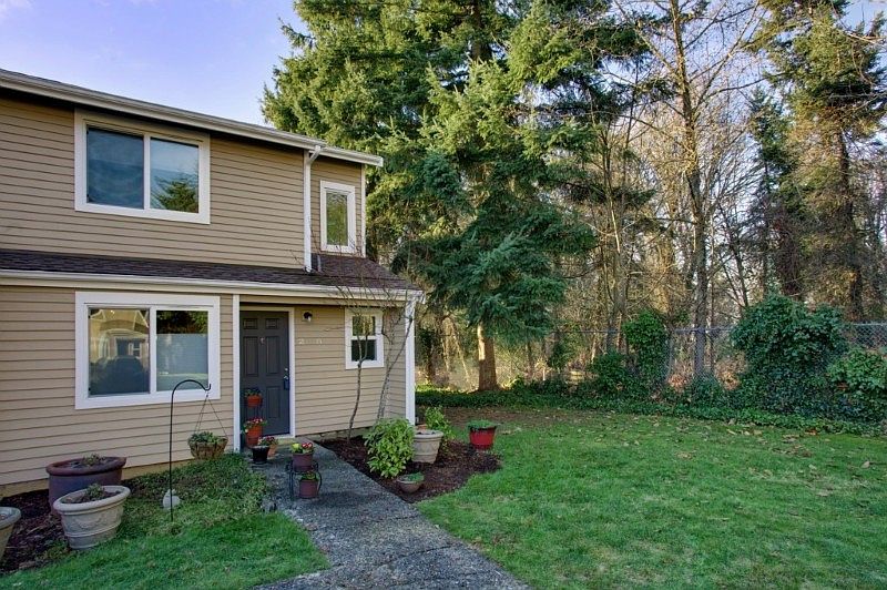 Two level townhome style condo in desirable Hudson Ridge community! Great end unit-backs to greenbelt for extra privacy!