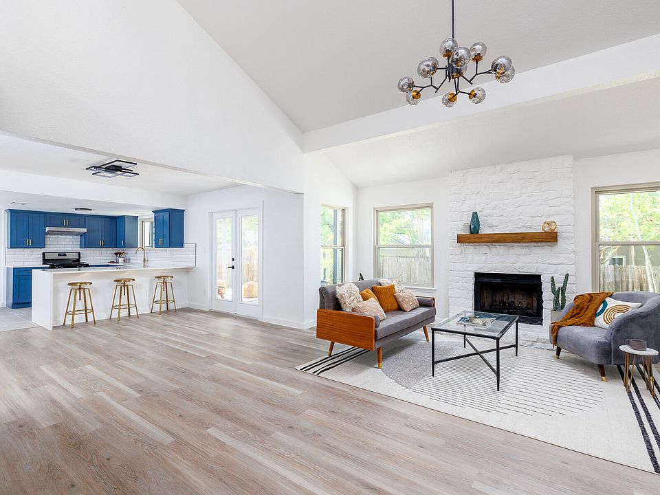 Main living room overlooking kitchen and dining area.