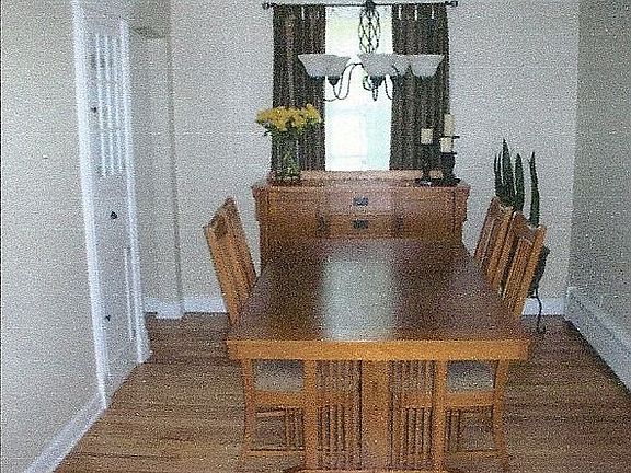 Spacious dining room features oak floors, built-in china cab. 