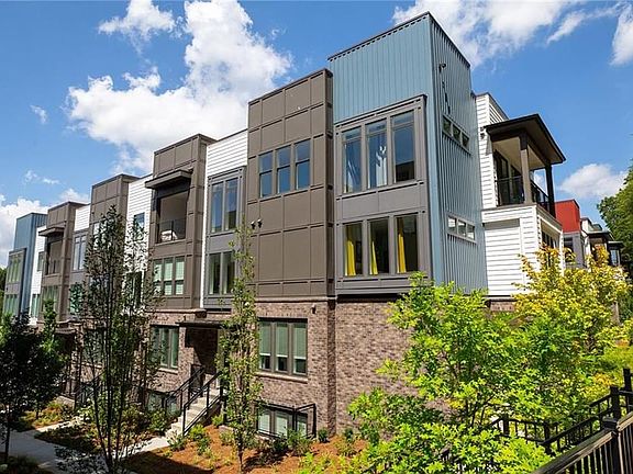 EXTERIOR PHOTOGRAPH of one building in community. Edgewood floor plan LOT 1506 is always a 3-story