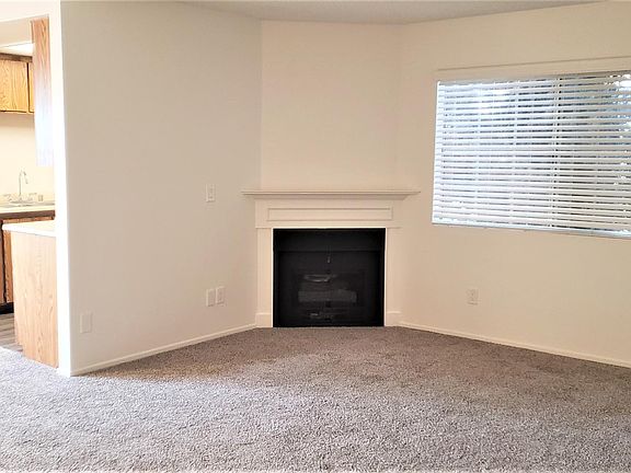 Spacious Livingroom with a gas fireplace. Freshly painted interior.