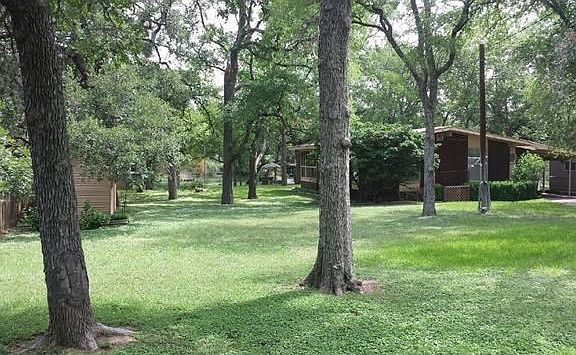 Front Exterior and Open Lot to the Left