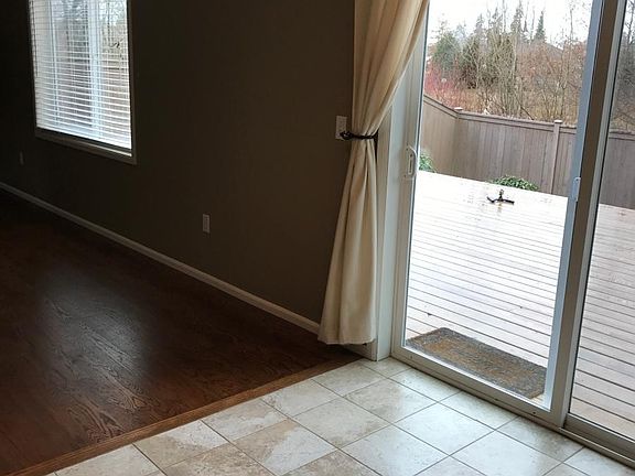 Dining room with view to deck and greenbelt.