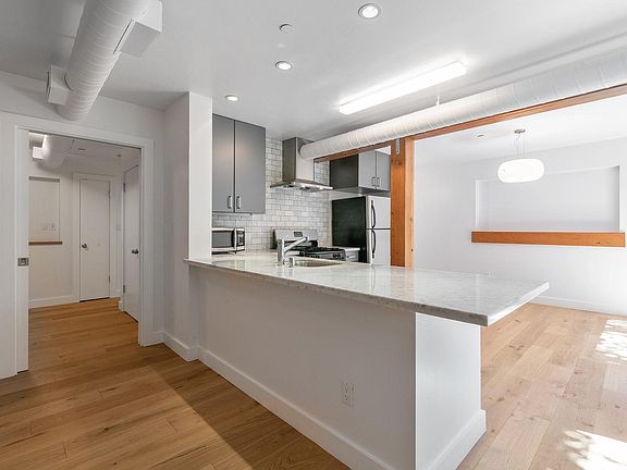 Kitchen with Carrera marble counter
