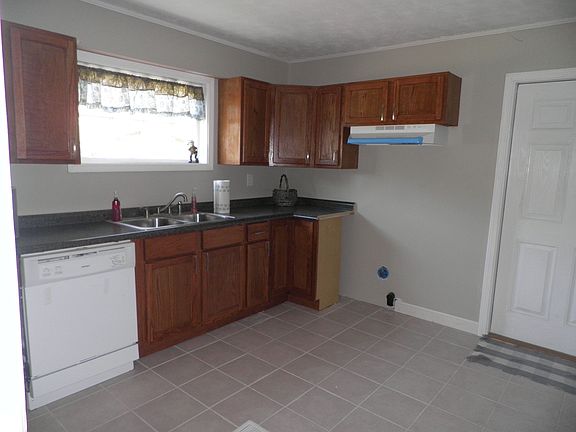Kitchen w/ new stove upon contract