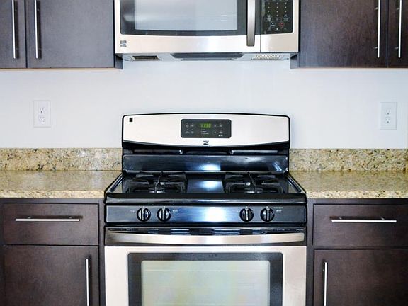 Kitchen features granite and stainless steel