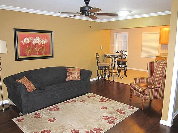 UPDATED HOME WITH WOOD FLOORS, CERAMIC TILE, CROWN MOLDING, DECORATIVE PAINT COLORS