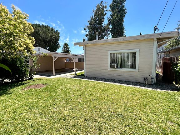 Front yard and view of carport