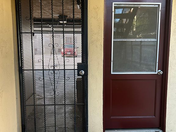 Laundry room and view to garage parking