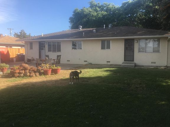 Back of the house. Rock are not currently part of landscape