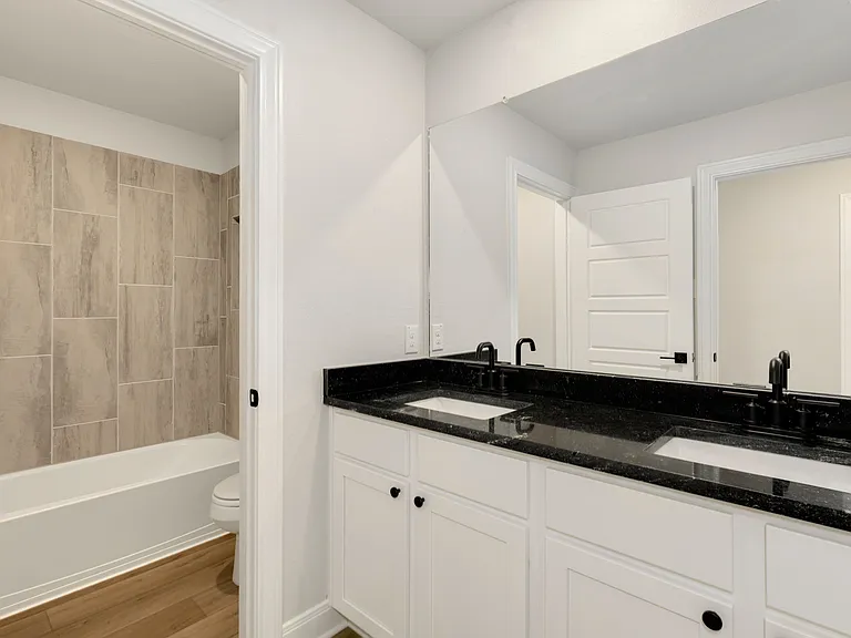 A dual sink vanity in the upstairs bathroom.