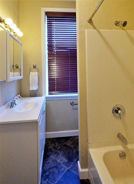 Updated bathroom with bath / shower